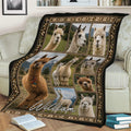 Alpaca blanket styled across a sofa with nature scenes, alpaca portraits, and a decorative border