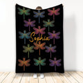 Black dragonfly throw blanket featuring colorful dragonflies arranged in a repeating pattern