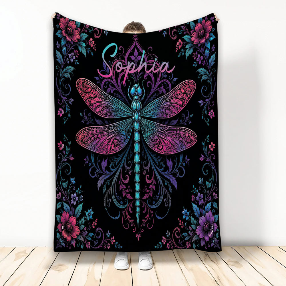 Dragonfly throw blanket with colorful floral border and ornate botanical artwork on a black background