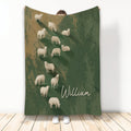 Custom sheep blanket with a rustic green and tan flock design displayed upright