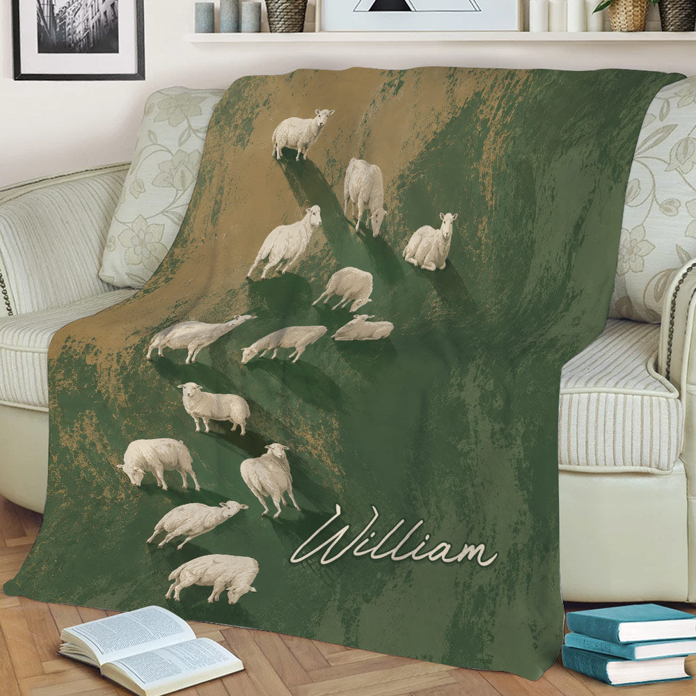 Rustic sheep blanket spread across a sofa with flock artwork in green and tan tones
