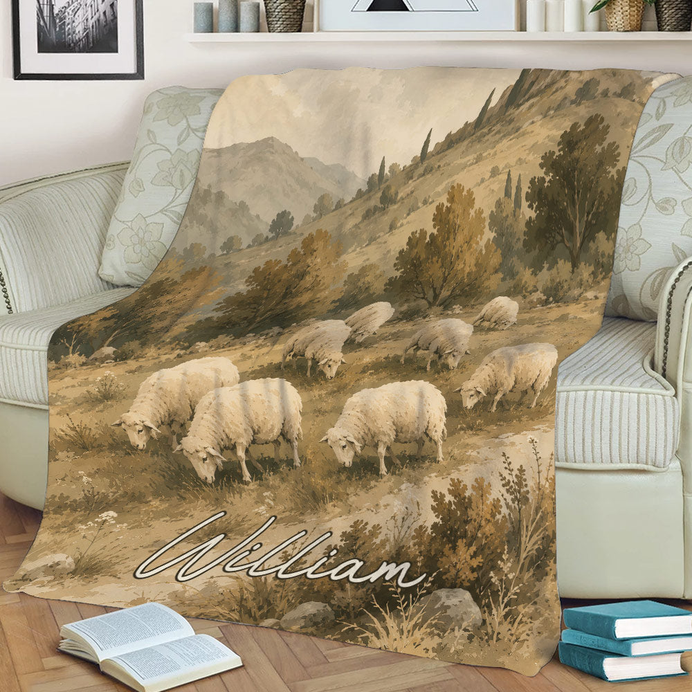 Rustic sheep throw blanket displayed on a sofa with vintage mountain and countryside artwork
