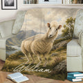 Sheep throw blanket displayed on a sofa with a tranquil mountain lake and meadow scene