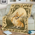 Rustic corgi throw blanket styled on a sofa with botanical artwork and cozy reading scene