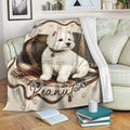 Westie blanket draped over a sofa with a white West Highland Terrier design and paw print pattern
