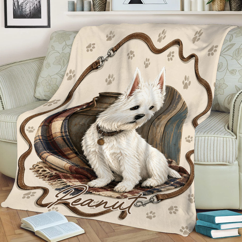 Close lifestyle view of a Westie throw blanket featuring a white terrier, plaid accents, and rustic artwork