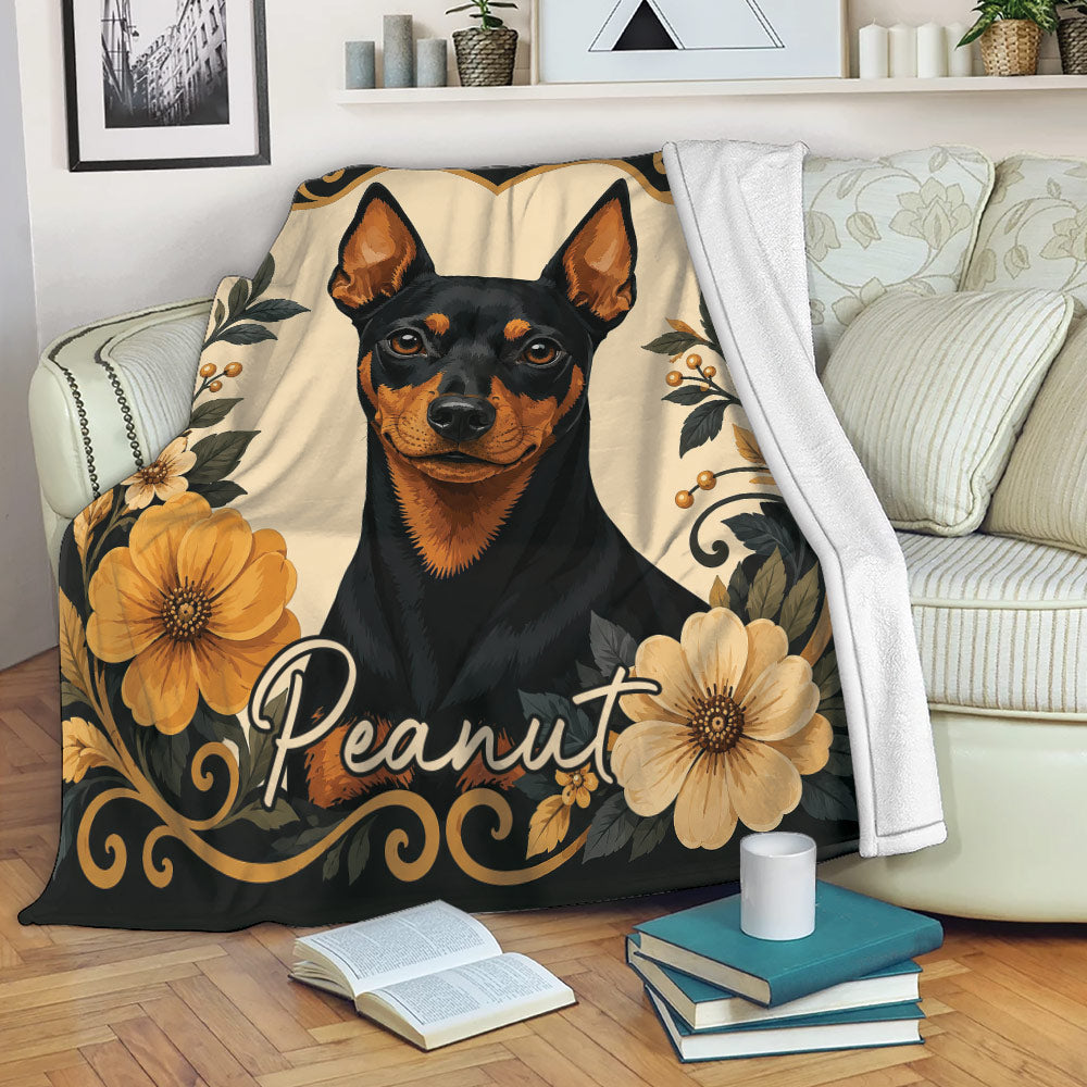 Miniature Pinscher throw blanket displayed on a sofa with floral dog artwork