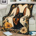 Close lifestyle view of a Miniature Pinscher blanket draped across a sofa
