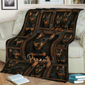 Miniature Pinscher throw blanket displayed on a sofa with rustic framed dog artwork
