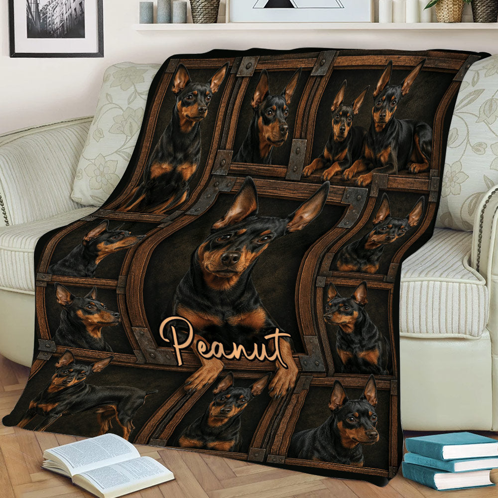 Miniature Pinscher throw blanket displayed on a sofa with rustic framed dog artwork