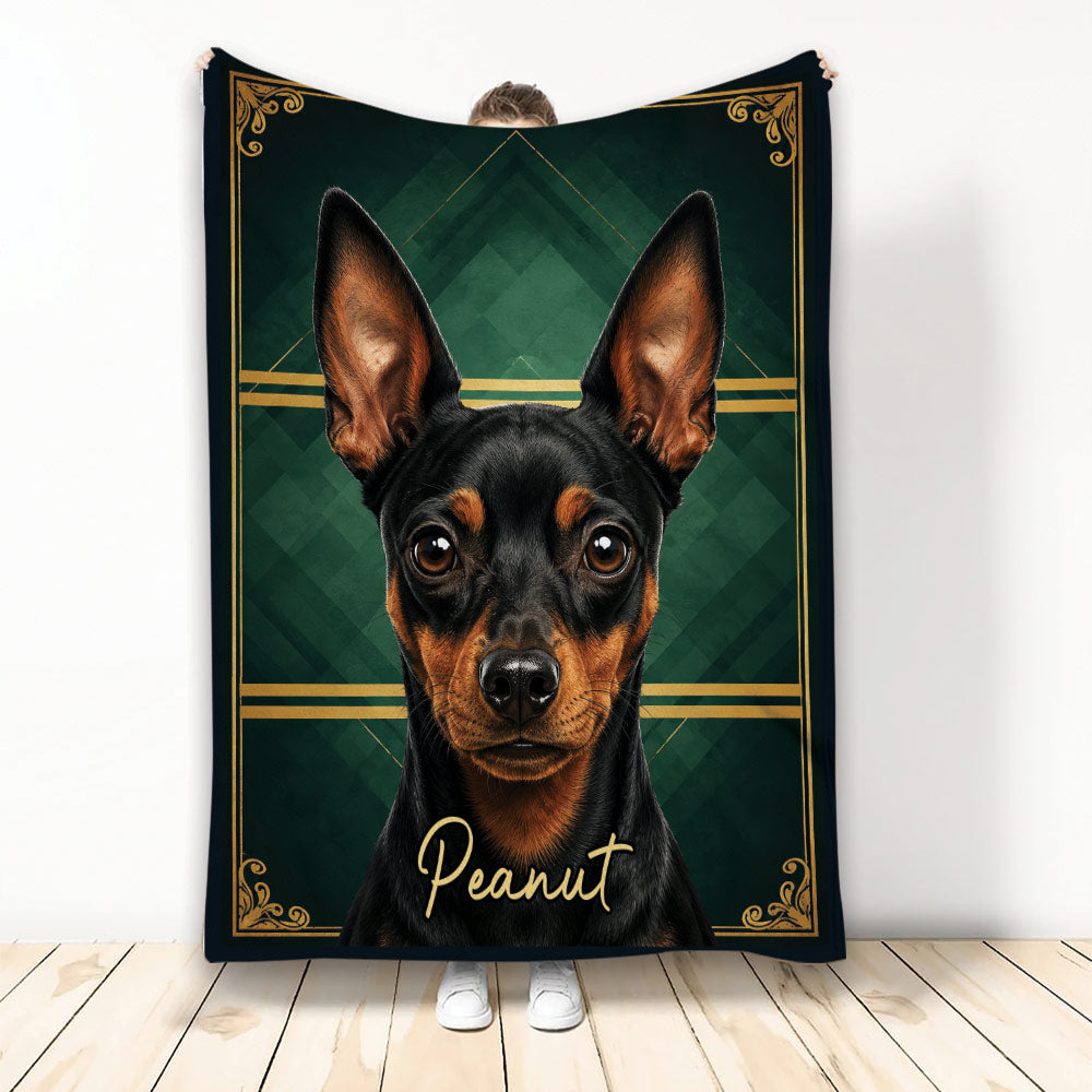 Black and tan Miniature Pinscher blanket displayed upright with dark green geometric and gold ornamental artwork