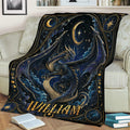 Ornate dragon throw blanket spread across a sofa with dark blue fantasy artwork and golden celestial accents