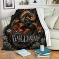 Dark fantasy dragon blanket with fiery artwork draped over a sofa in a cozy living room