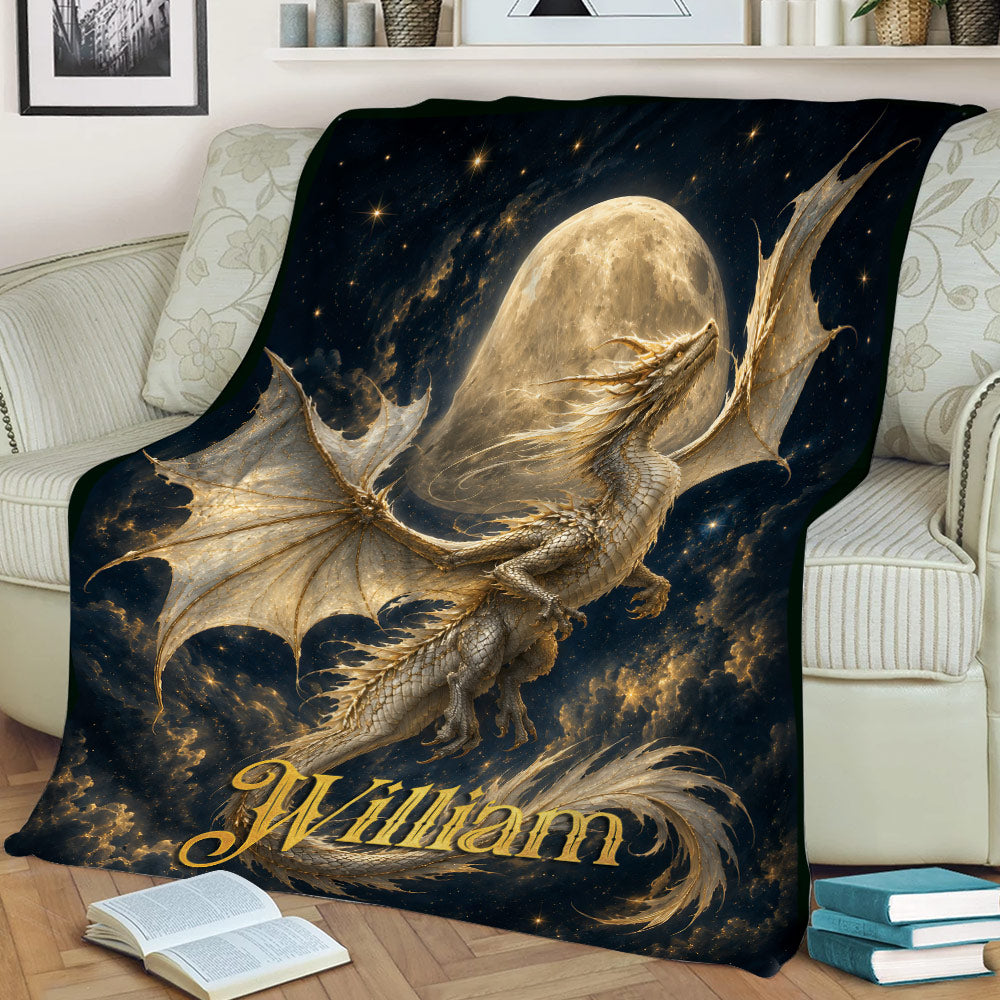 Fantasy dragon blanket displayed on a couch with dramatic wings, stars, clouds, and moon artwork