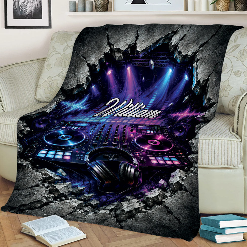 Colorful DJ blanket draped over a couch with mixing equipment, headphones, speakers, and dramatic rock details
