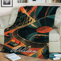 DJ blanket displayed on a couch with vintage turntable, record, mixer, and colorful music artwork