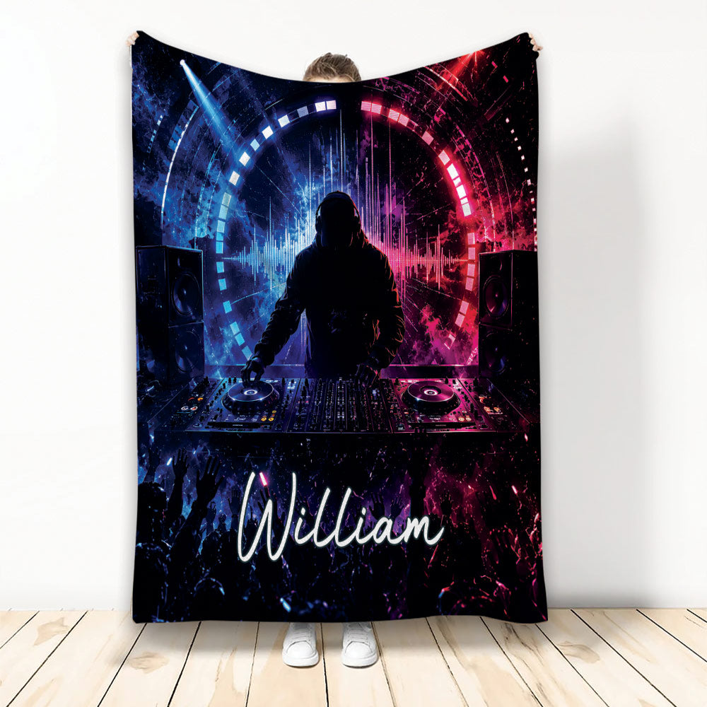 DJ throw blanket featuring a turntable performer, speakers, concert crowd, and vivid blue and magenta lighting