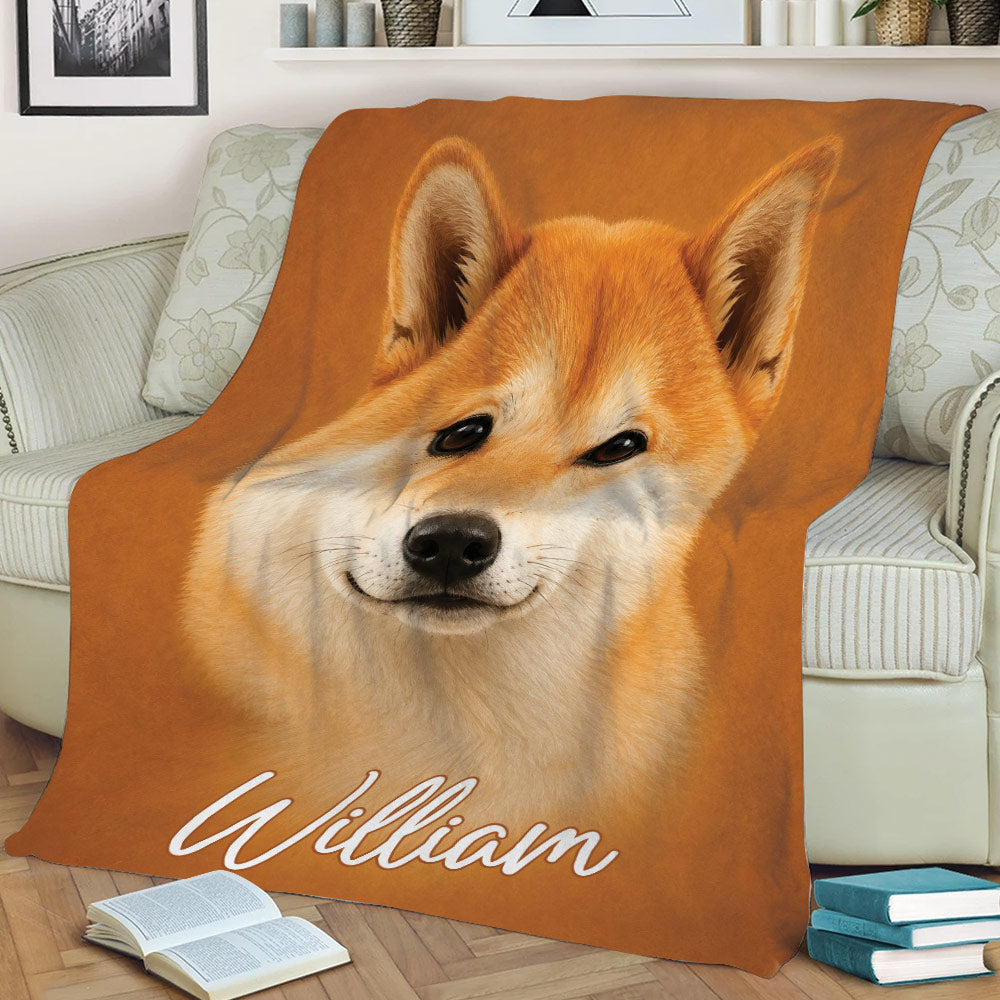 Close-up Shiba Inu throw blanket styled across a living room sofa
