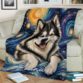 Alaskan Malamute blanket spread across a sofa with vibrant blue and gold artwork