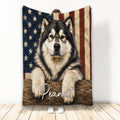 Alaskan Malamute blanket with patriotic American flag artwork and a rustic wood background