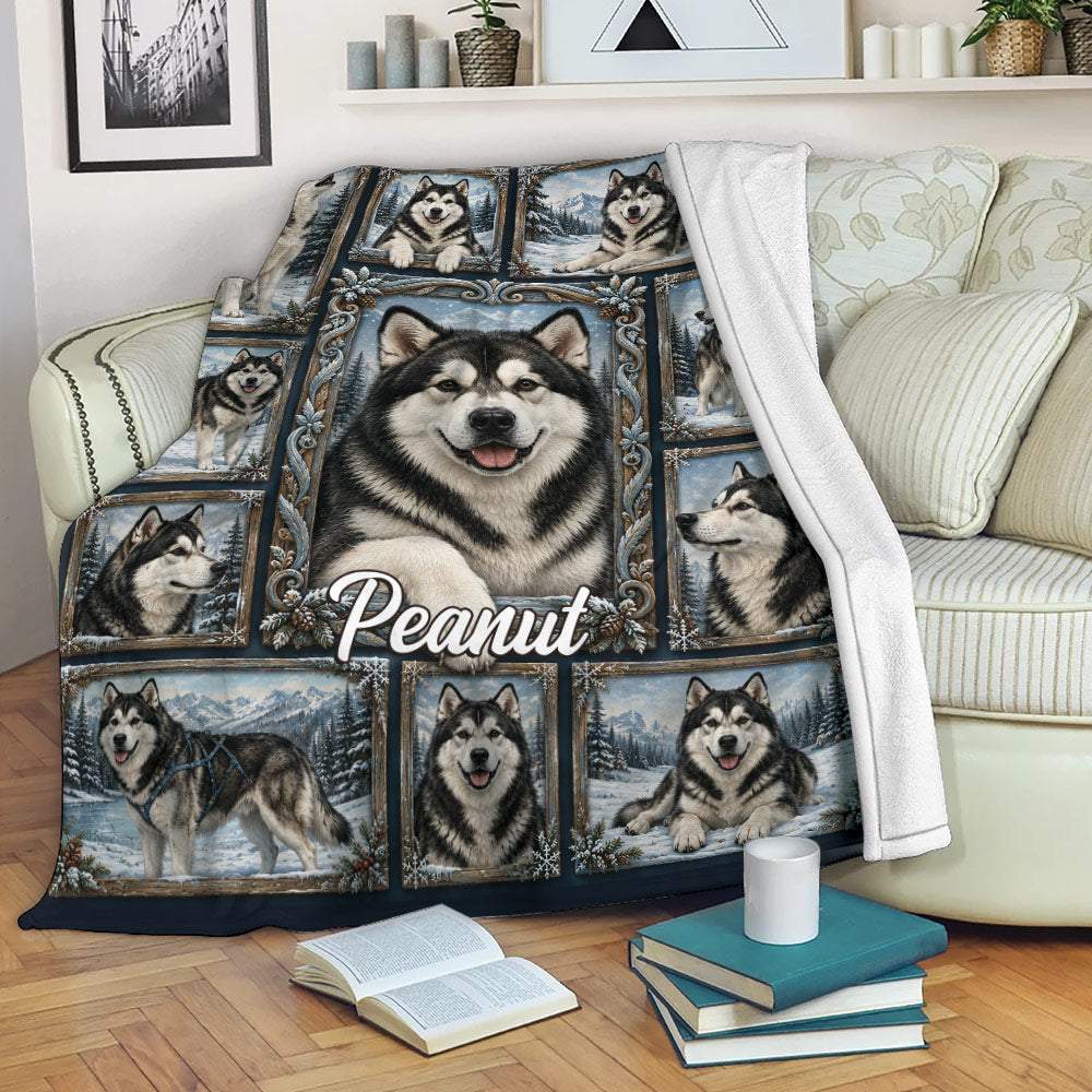 Alaskan Malamute blanket draped over a sofa, featuring multiple dogs in ornate winter landscape frames