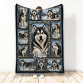 Alaskan Malamute throw blanket displayed vertically with a framed collage of dogs in snowy mountain scenes
