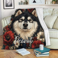 Alaskan Malamute throw blanket draped over a sofa with bold floral artwork and cozy living room decor