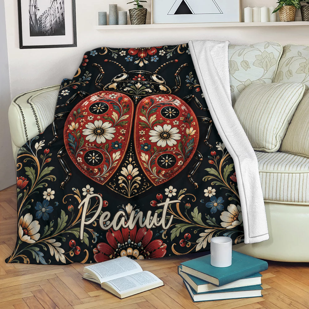 Floral ladybug throw blanket draped over a sofa in a cozy living room setting