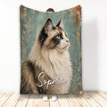 Ragdoll cat throw blanket with blue-eyed long-haired cat artwork and vintage teal botanical background