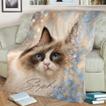 Blue-eyed Ragdoll cat throw blanket displayed across a sofa with soft watercolor-style sparkle details