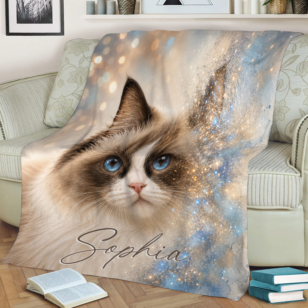 Blue-eyed Ragdoll cat throw blanket displayed across a sofa with soft watercolor-style sparkle details