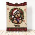 Yorkie Christmas throw blanket displayed vertically with Santa hat, wreath, gift, snowflakes and plaid trim