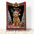 Goldendoodle Christmas blanket featuring a festive dog in a Santa hat, lights, gifts, and snowy trees