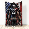 Custom football blanket featuring a player holding a football in bold red, white, blue, and black artwork