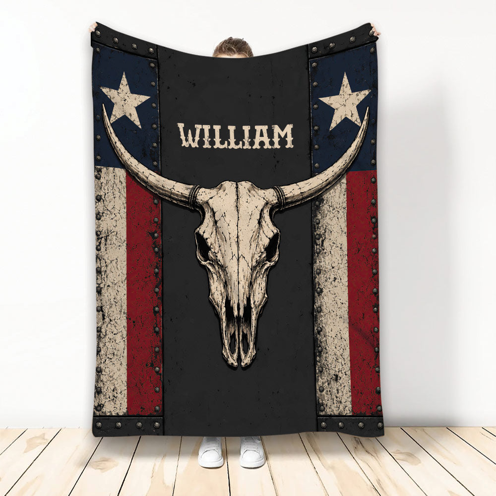 Rustic cowboy throw blanket featuring a western bull skull, stars, and distressed red, navy, black, and cream artwork