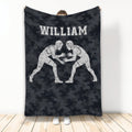 Wrestling throw blanket with two grapplers in headgear on a dark camouflage background