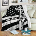 Lineman throw blanket displayed on a sofa with distressed black and white utility worker artwork