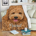 Goldendoodle blanket draped over a sofa with a friendly curly golden dog design