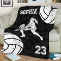 Volleyball couch blanket displaying a female player silhouette, large volleyballs, and monochrome sports artwork