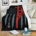 Patriotic lineman blanket draped over a sofa with a utility worker and flag-inspired design