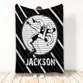 Custom wrestling throw blanket featuring two wrestlers grappling on a mat in bold black and white artwork