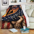 Patriotic lineman blanket draped over a sofa with power pole artwork and utility worker silhouette