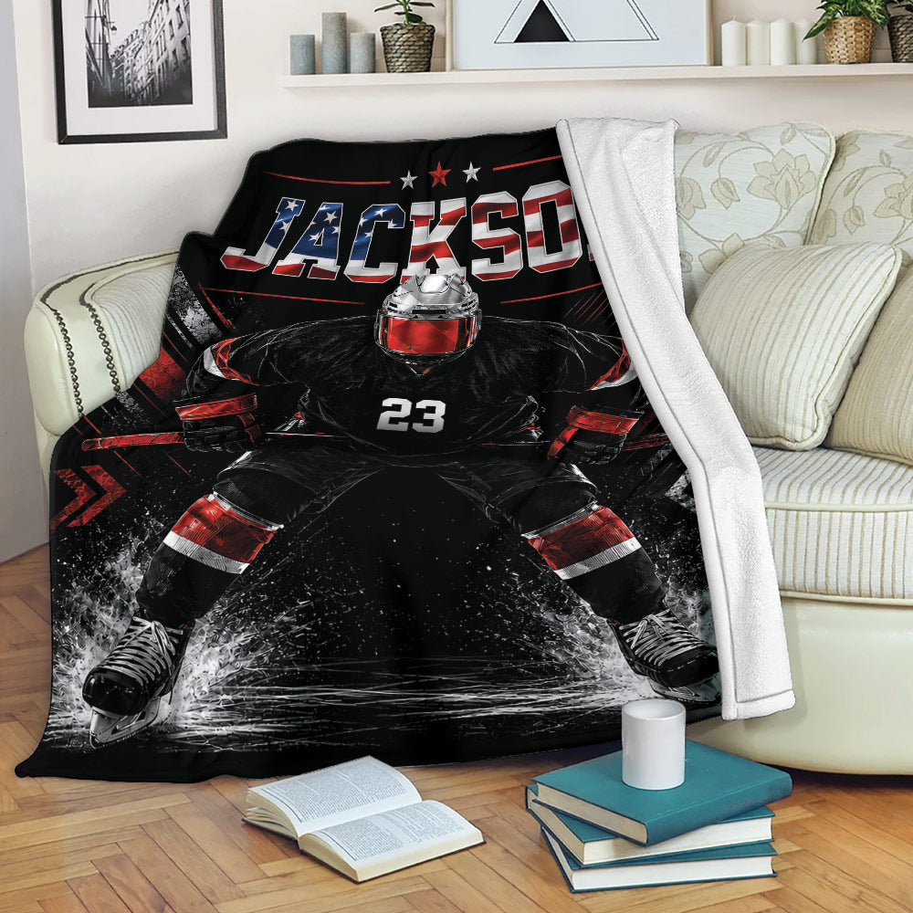 Hockey throw blanket displayed on a sofa with a dramatic goalie design in black, red and white