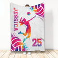 Colorful volleyball throw blanket displayed upright with female player artwork and vibrant sports graphics