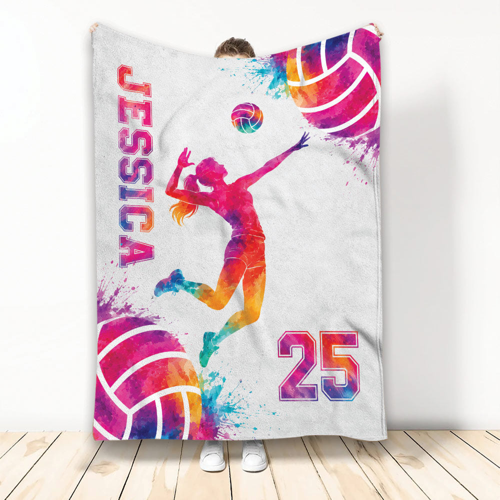 Colorful volleyball throw blanket displayed upright with female player artwork and vibrant sports graphics