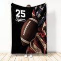 Football throw blanket displayed with an oversized football, patriotic star pattern, and red accents