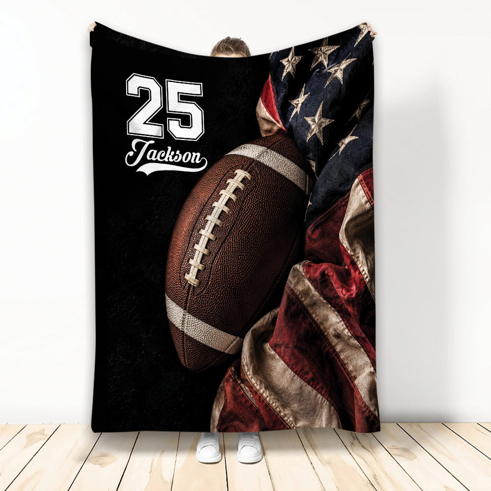 Football throw blanket displayed with an oversized football, patriotic star pattern, and red accents
