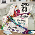 Softball player artwork and motivational typography on a couch blanket