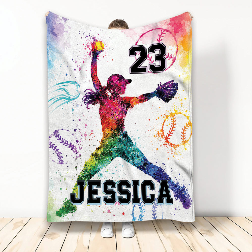 Colorful softball throw blanket featuring a female player silhouette, softball artwork, and vibrant paint splashes