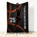Basketball throw blanket featuring a jumping player silhouette, glowing orange court lines, and dark sports artwork